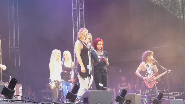 Steel Panther holding the boobs flash contest