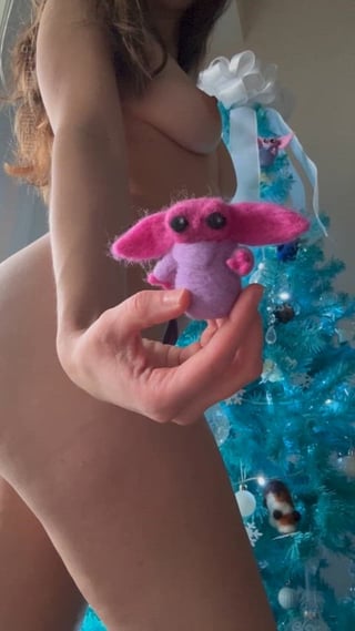 Putting the little Grogu I made on my Christmas tree [f]